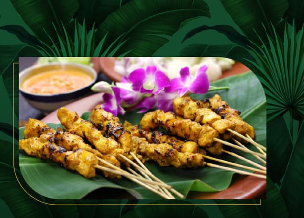 Chicken on a stick lying on a green leaf Chicken on a stick lying on a green leaf.