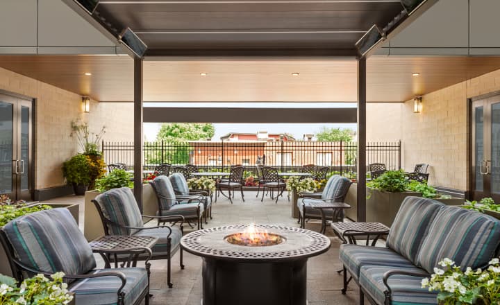 TheGlebe-home-outdoor_patio_with_chairs_and_fireplace_overlooking_greenery_and_surrounding_neighbourhood TheGlebe-home-outdoor_patio_with_chairs_and_fireplace_overlooking_greenery_and_surrounding_neighbourhood