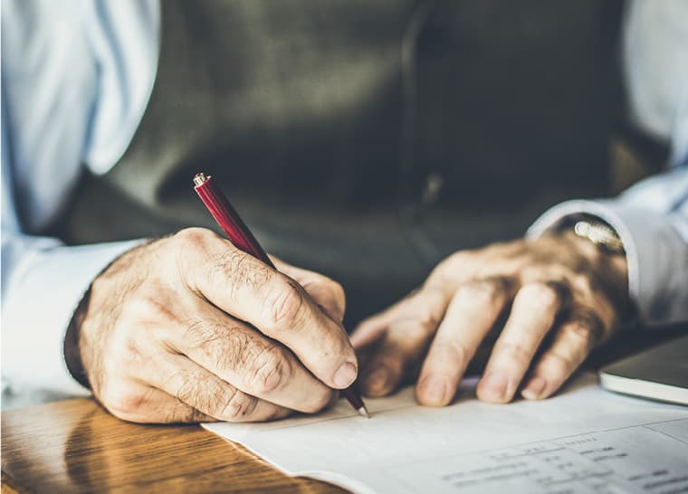 What is Your Plan? A Virtual Amica Event close-up shot of a senior's hands signing a legal document