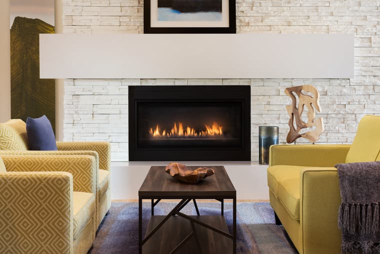 Amica Edgemont Village Lobby with Fireplace Fireside lobby at Amice Edgemont Village