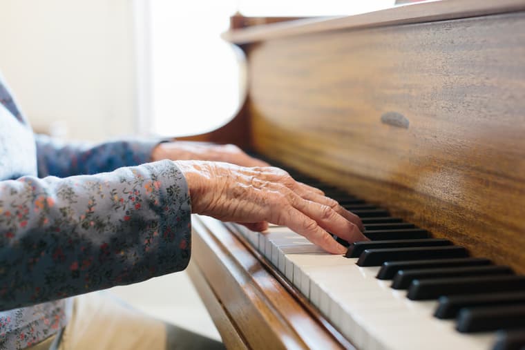 Amica Beechwood Village Piano with Hands Grand piano at Amica Beechwood Village senior living residence.