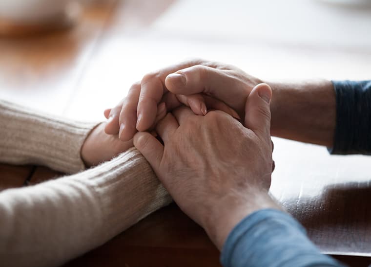 Amica Senior Lifestyles- Image for National Event Isolation for Seniors Seniors with hands on top of each other