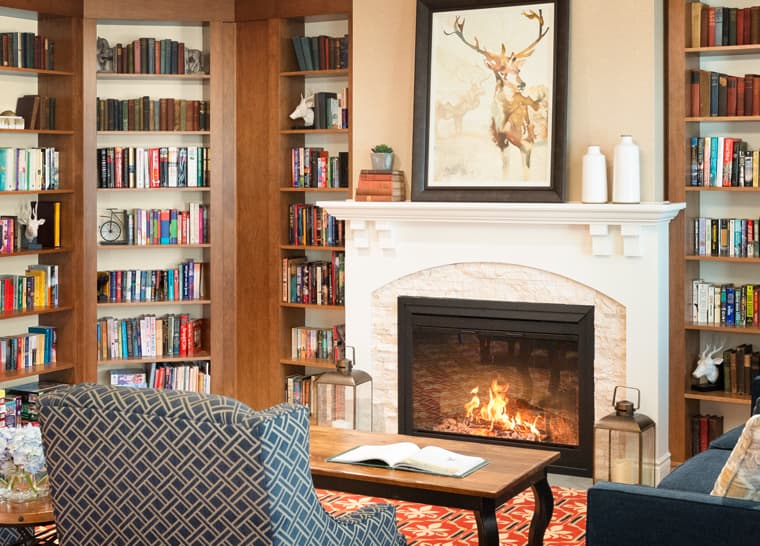 Stoney Creek - Library with Fireplace 2 Library with fireplace at Amica Stoney Creek senior residence.