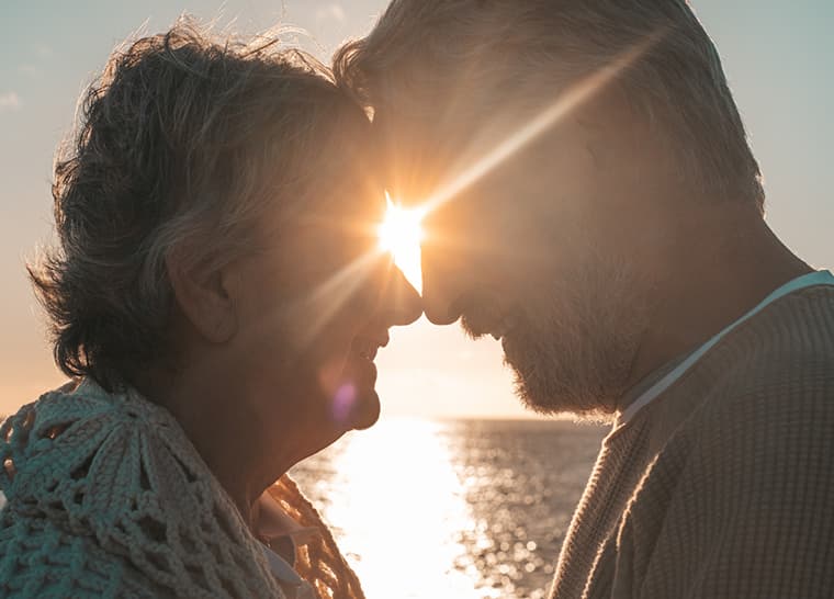 Amica National Event Passion Reignited Homepage Image Senior Couple Passionately Engaging and Smiling in the Sunset